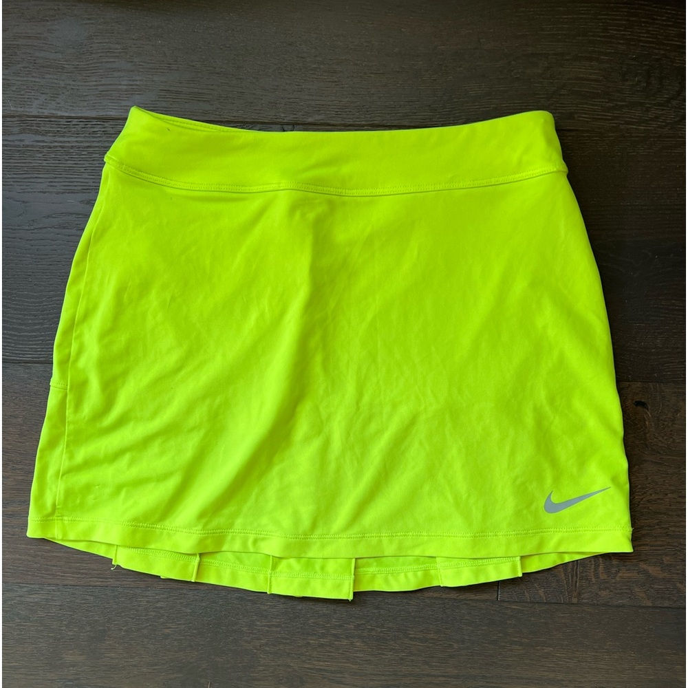 Super cute Nike Golf skirt Size XSM. Has such cute details on the bottom. Neon.